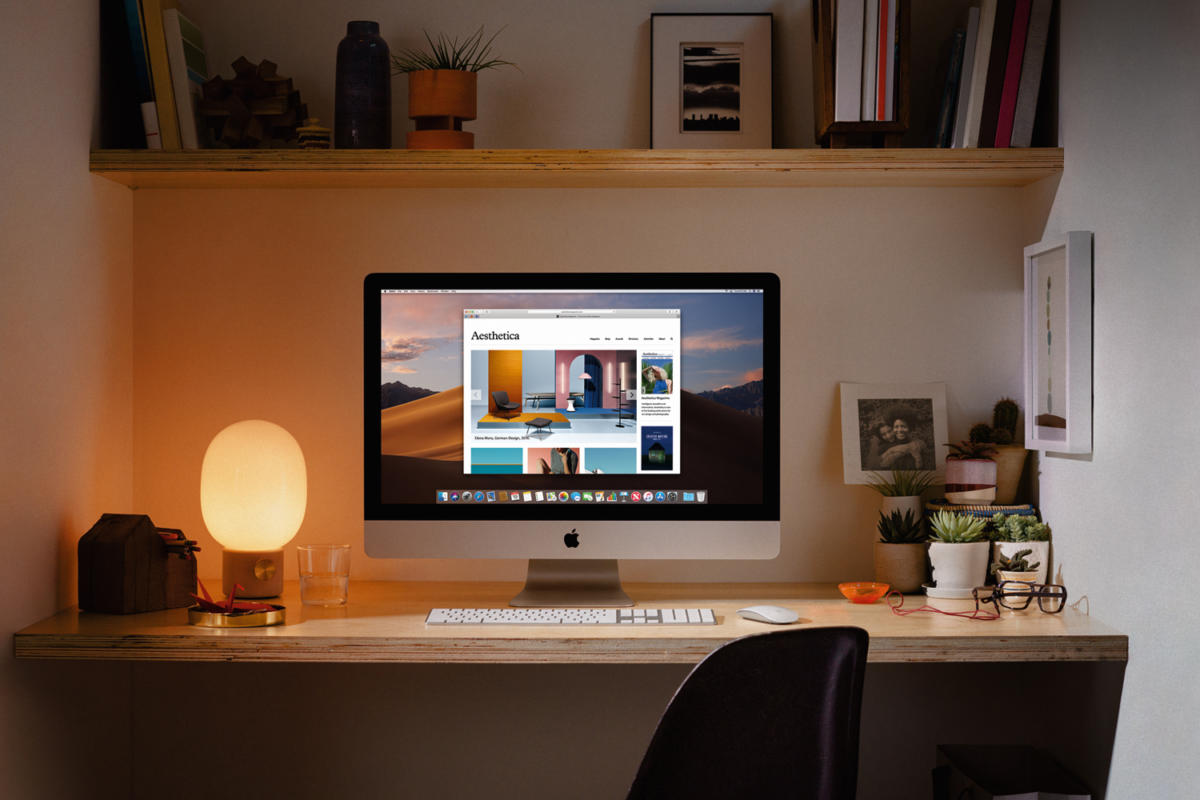 desk with lamp and computer